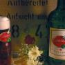 Gasthof Hotel Waschka, © Gasthof Hotel Waschka Ein Glas und eine Flasche Libellen Bräu Bier mit Blumen im Vordergrund.